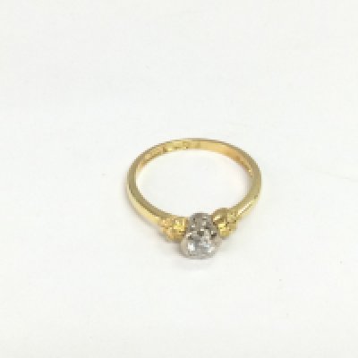 An 18ct gold diamond solitaire ring, approx 2.6g and approx size K. Shipping category A.