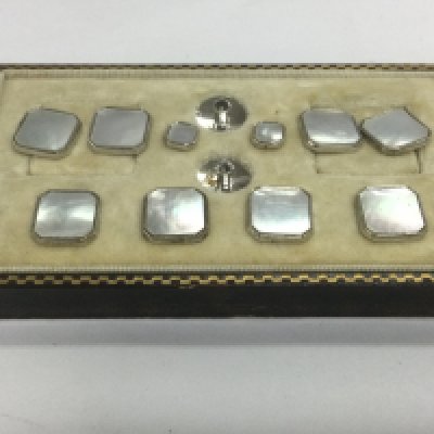 A boxed antique silver and mother of pearl cufflinks dress set. Shipping category A.