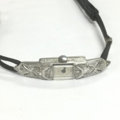 A ladies platinum and diamond set cocktail watch. Shipping category A.