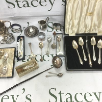 A small collection of silver comprising jug, cruet set, cased silver spoons. Shipping category B.