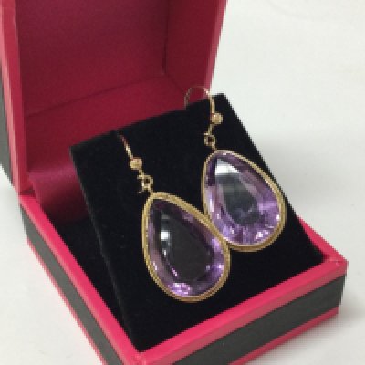 A pair of 9ct gold amethyst earrings, 6.2g total weight . Postage cat a