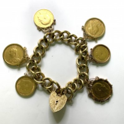 A heavy 9ct gold bracelet with heart lock with 4 Full sovereigns (3 with 9ct gold coin mounts) 1898, 1899, 1902, 1910 (soldered mount), 2 half sovereigns (9ct gold coin mounts) 1905, 1908. (A), total weight 103.07g