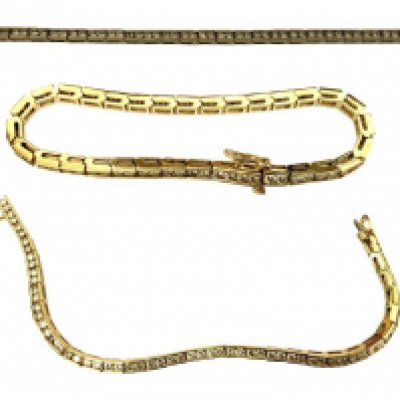 A fine 14k yellow gold diamond line bracelet, inset with 64 x 0.2ct brilliant cut diamonds.