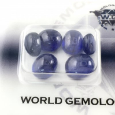 Security sealed parcel of 6 oval cabochon deep blue sapphires. 19.16 Postage A