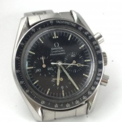 An Omega Speedmaster professional circa 1969/70 man on the moon watch. Stainless steel case and strap with the classic black dial and a patina start8ng to show on hands and markers. Watch is seen running.