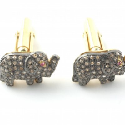 A pair of silver gilt diamond set elephant cufflinks with ruby eyes. Diamonds approx 0.70ct and ruby 0.03ct