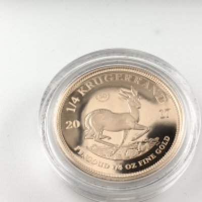 A 2017 50th anniversary 1/4 oz gold proof Krugerrand. Postage B