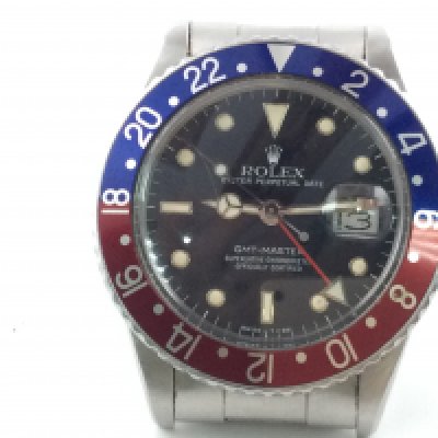 A Rolex GMT Master Pepsi watch. Stainless steel oyster strap. 40mm case. Dated to 1986. Seen working.
