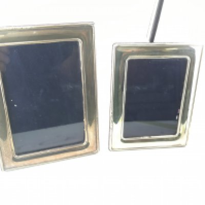 Two silver hallmarked photo frames. Larger frame is 14x19cm