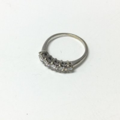 A 9ct white gold five stone diamond ring. Approx weight 2.3 grams, size M.