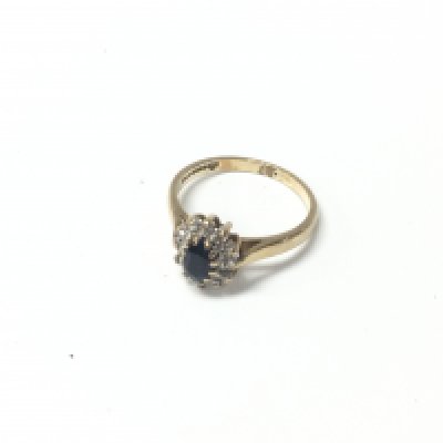 A diamond and sapphire 9ct gold ring. Approx weight 2.62 grams, size O.