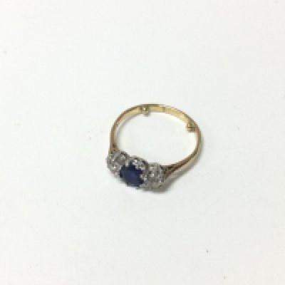 An 18ct gold diamond and sapphire ring. Approx weight 2.41 grams, size L 1/2.