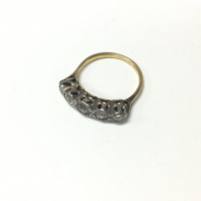 An 18ct gold five stone diamond ring. Approx weight 3.29 grams, size P.