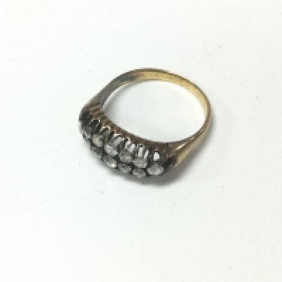 A yellow metal 12 stone set ring. Approx weight 5.78 grams, size S.