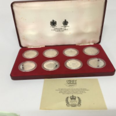 A cased set of eight silver 1977 commemorative coins in a fitted Spinks case with certificate of Authenticity. Each coin 28.2g (8)