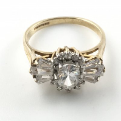 A 9ct gold ring set with white stones. Size N and 3.30g Postage A