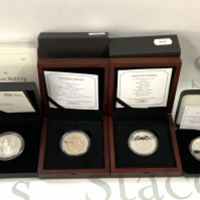 A cased Royal Mint Platinum Wedding anniversary &#20132660835 silver coin together with 3 commemorative silver cased coins. (A)