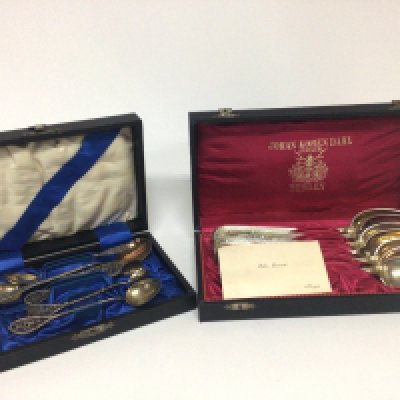 A cased set of Norwegian silver spoons Johan Korean Dahl Bergen and a cased set of filigree tea spoons and tongs.