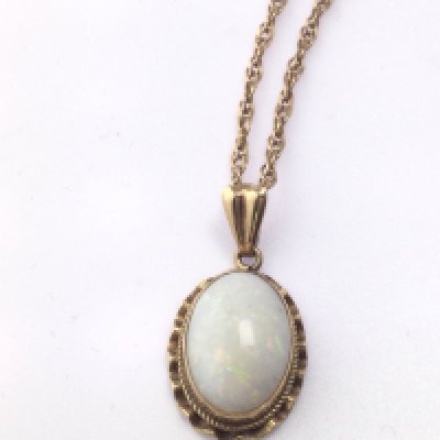 A 9ct gold chain with opal pendant. Total weight 4.42g