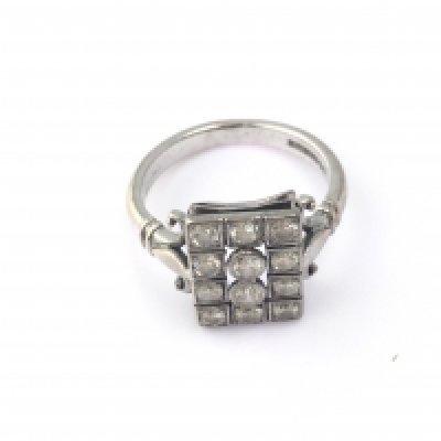 An 18ct white gold 1930s diamond cluster ring. Size M and 5.05g