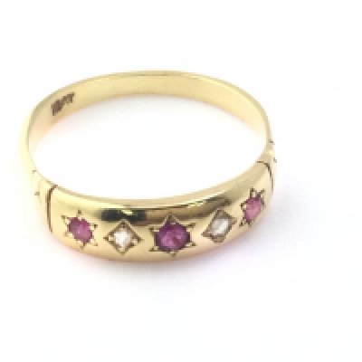 An 18ct Edwardian ruby and diamond ring. Size O and 2.70g