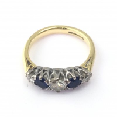 18ct sapphire and diamond ring. Centre diamond 0.45ct size M 1/2 and 4.88g Postage A