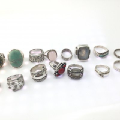 A collection of 15 assorted silver rings.