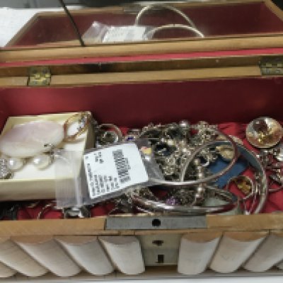 A box of costume jewellery including silver