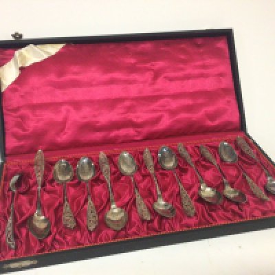 A cased set twelve of white metal Norwegian teaspoons with filigree decoration