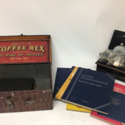 A Vintage Lovells Toffee tin in the form of a crocodile skin case and a collection of British coins in blue albums and world coins all used circulated.