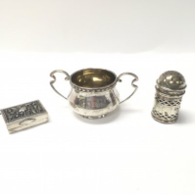 Three silver items including a Continental pill box, a silver salt pot with a blue glass liner and a George v sterling silver small bowl.