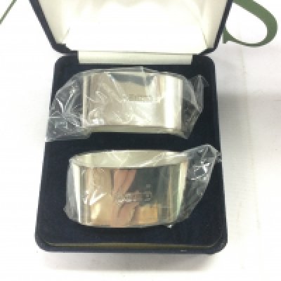 A pair of boxed silver napkin rings, Sheffield hallmarks. Shipping category A.