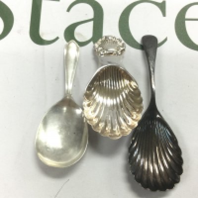 Three silver caddy spoons. Shipping category A.