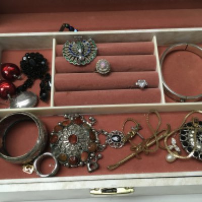A collection of costume jewellery including a silver hallmarked bangle bracelet, rings, brooches, necklaces etc. postage category B