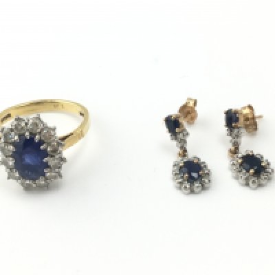 An 18ct sapphire and diamond ring size O and a pair of sapphire drop earrings. Postage B