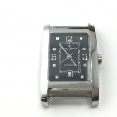 A Baume & Mercier Hampton automatic wrist watch. Black dial and steel case. No strap but comes with box. Winds and runs. Postage B