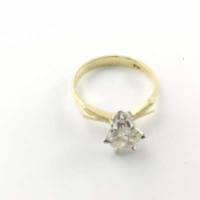 An 18ct gold and diamond solitaire ring. Diamond is approximately 1.15ct colour I and I2 (note large flaw viable). Size P 1/2 and 3.44g
