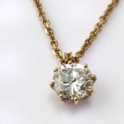 A round cut diamond pendant in 18ct (unmarked) gold. Diamond is approximately J/K and VS1/VS2 and is approximately 1.73ct.