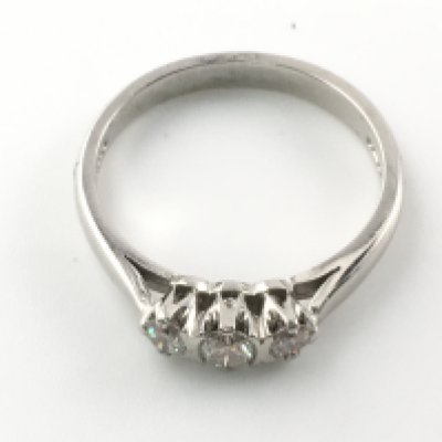 A platinum and diamond trilogy ring. Size N and 4.13g Postage A