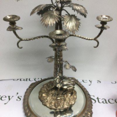 A fine quality Victorian Elkington & Co silver plated four branch candelabra on a mirrored base, approx height 65cm. Shipping category D.