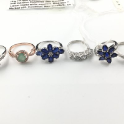 WITHDRAWN - A collection of assorted silver rings set with various gems including sapphires etc. Postage B