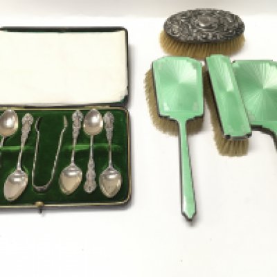 A cased set of silver spoons and a silver and enamel dressing table set. Postage B