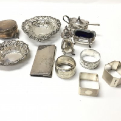 A collection of assorted silver items including napkins rings cruet items etc. total weight approximately 340g