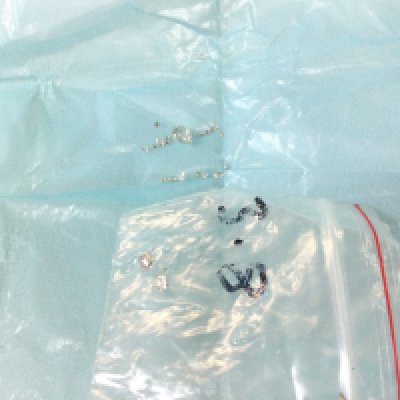 A packet of small loose diamond stones and one approx 0.1 carat old cut stone with inclusion. Postage category A