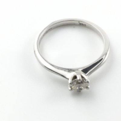 An 18ct white gold and 0.40ct solitaire diamond ring. Size M and 2.72g Postage A