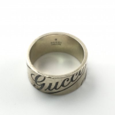 An 18ct gold Gucci ring. 9.29g and size O. Postage A
