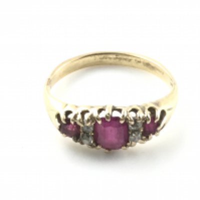 An 18ct Victorian yellow gold ruby and diamond seven stone ring. Size K and 3.20g. Postage A