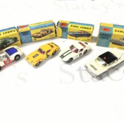 4 X Boxed Corgi Vehicles. A Porsche Carrera #330. A Customized Chevrolet Chevrolet Corvette Sting Ray #337. A Marcos 1800 G.T #324 And A Chevrolet Police Car #481.