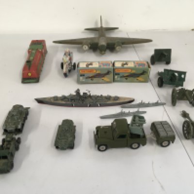 An assorted group featuring 2 boxed matchbox 75 S2 jets a tinplate train and police motrcycle. Various military themed items including ships, cars and a wooden hand made plane. No reserve