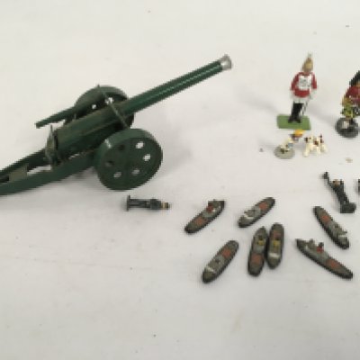 A artillery model gun by Britains and other figures by Crescent and others. No reserve
